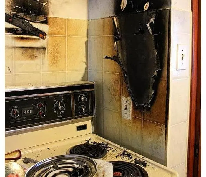 Damaged walls after a kitchen grease fire.