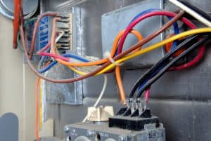 Colorful wiring used in the circuitry of a 20-year old home furnace installation.
