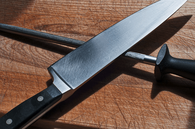stainless steel knife resting on knife sharpener
