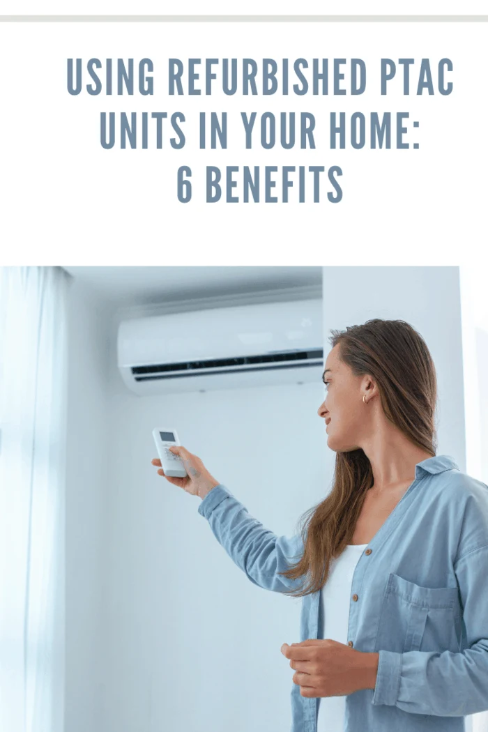 Young woman adjusts the air conditioner using a remote control in room