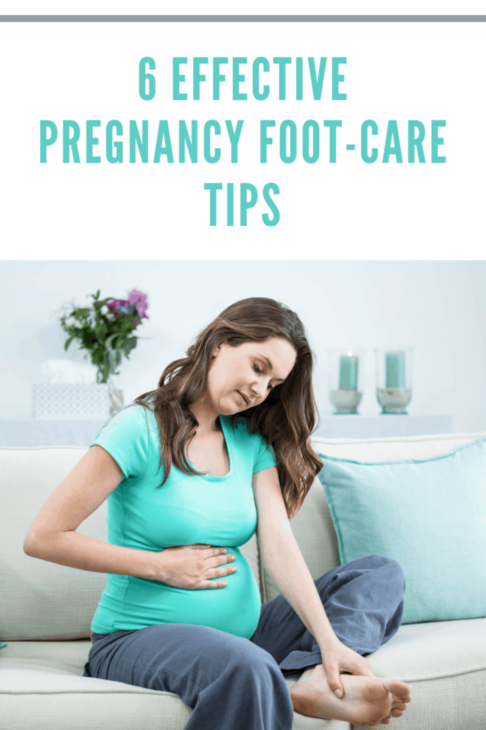 Pregnant woman massaging her tired feet