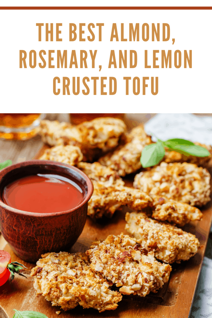 almond rosemary and lemon crusted tofu with ketchup on wood background. 