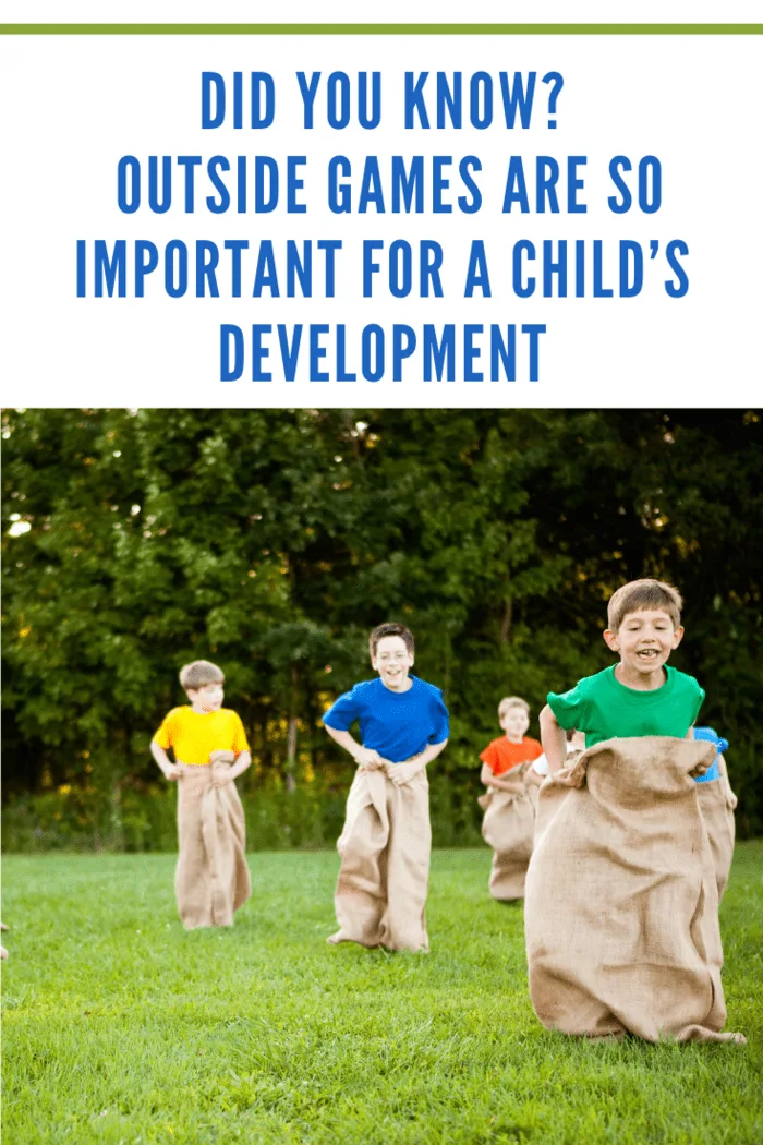 Happy kids having a potato sack race outside