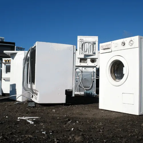 White goods in a dump with no visual brand names.