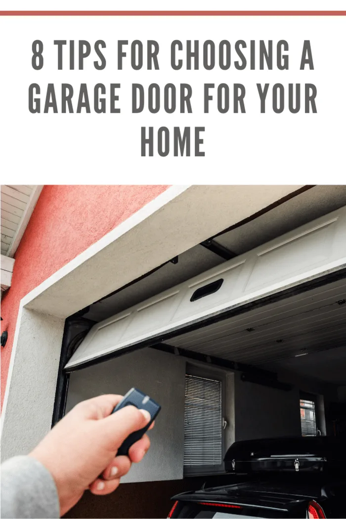 Man using remote control to close a modern garage door