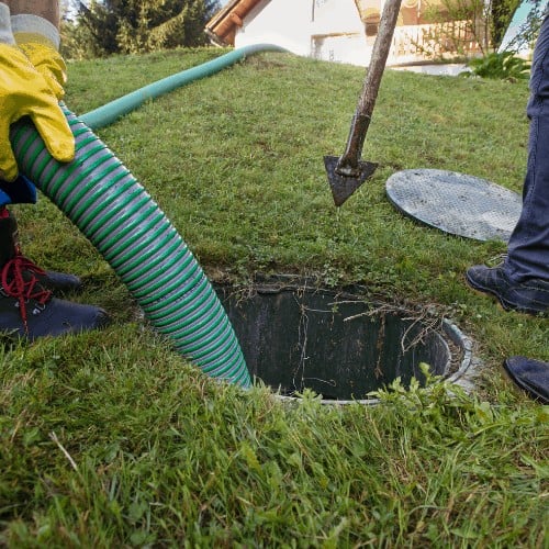 Emptying household septic tank. Cleaning and unblocking clogged drain.