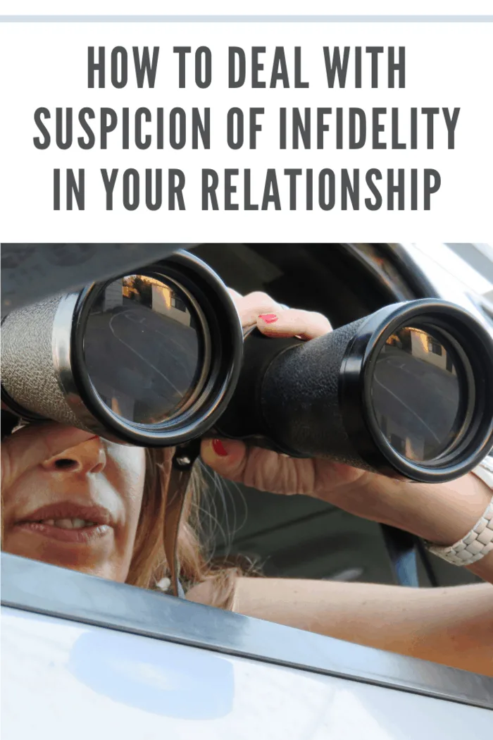 woman dealing with suspicion of infidelity looking through binoculars