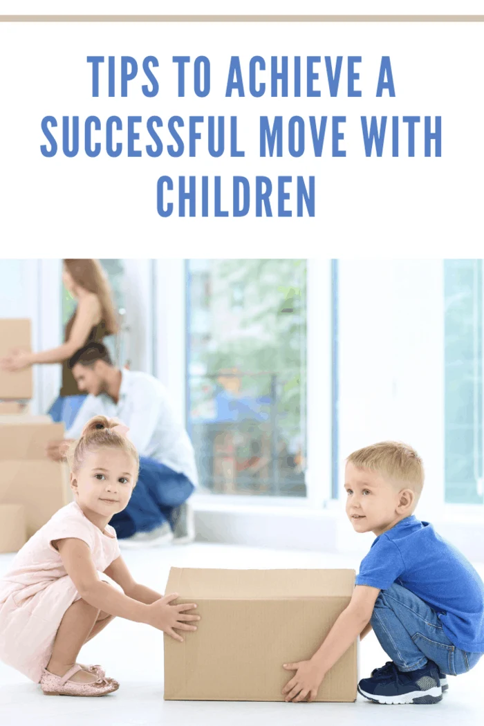 Happy children with moving box in their new house.
