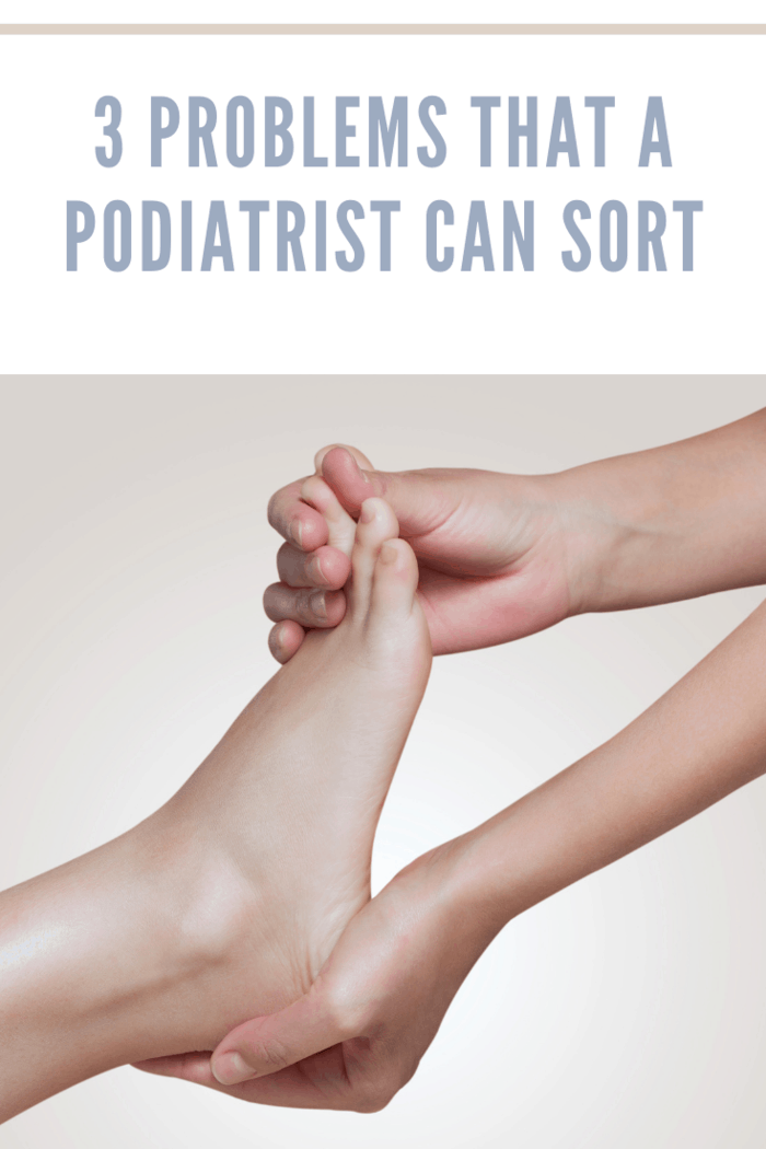 podiatrist does an examination and massage of the patient's foot