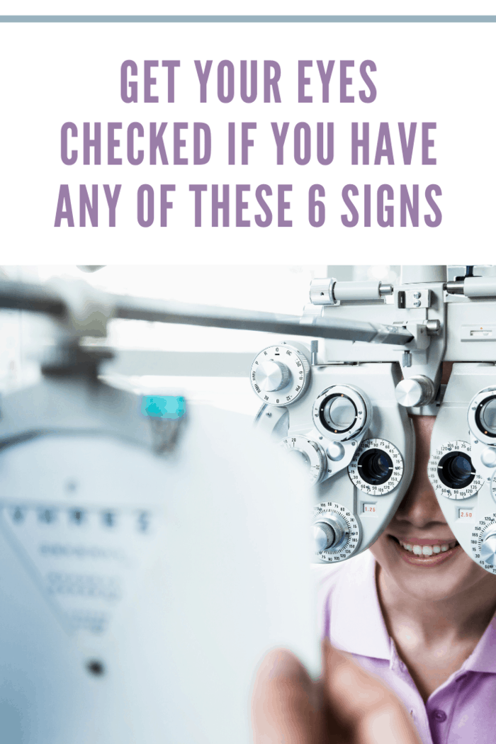 Close-up of optometrist doing an eye exam on young woman