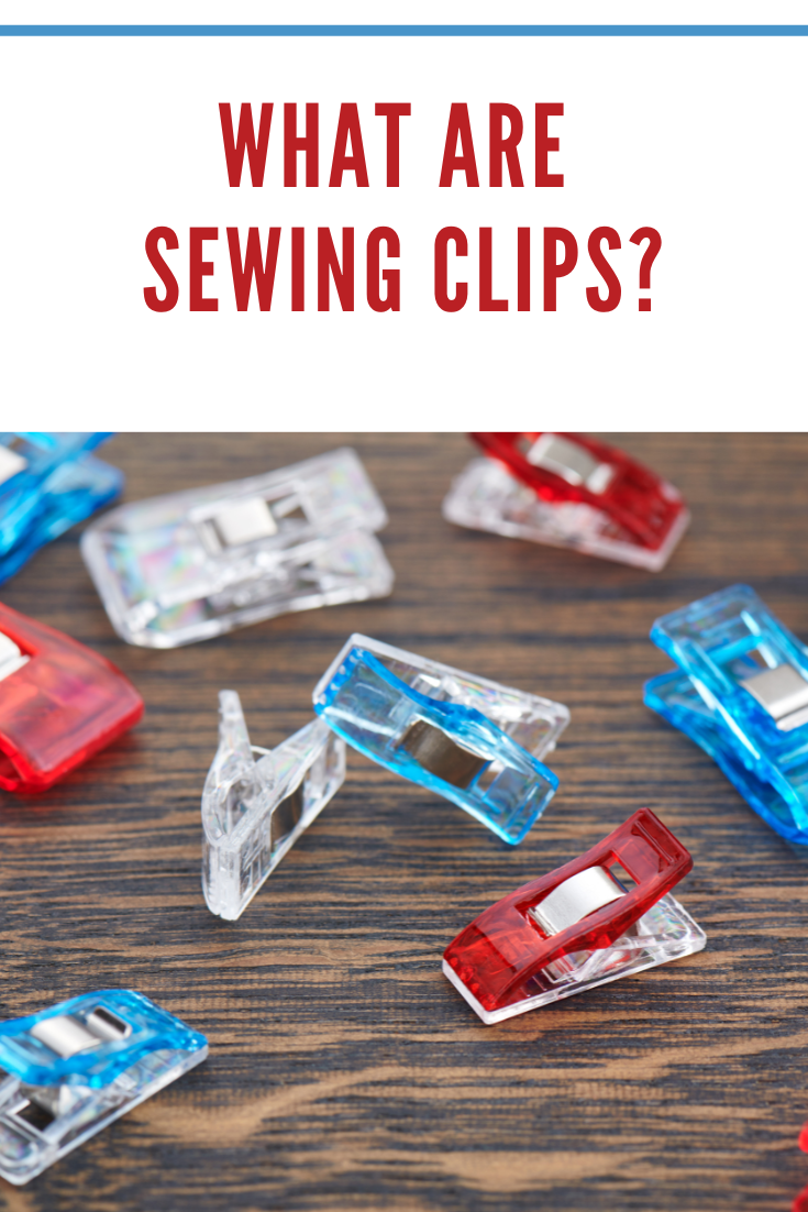 Bright sewing quilting clips on a wooden surface