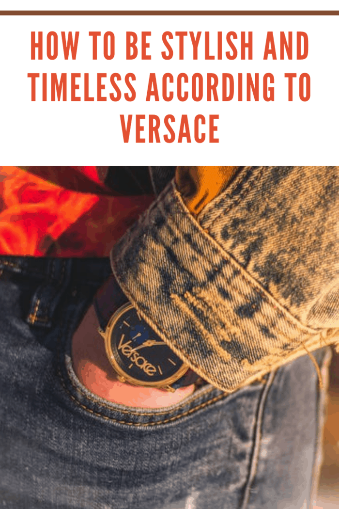 Versace watch on arm in jeans pocket