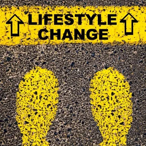 Lifestyle Change message. Conceptual image with yellow paint footsteps on the road in front of horizontal line over asphalt stone background.