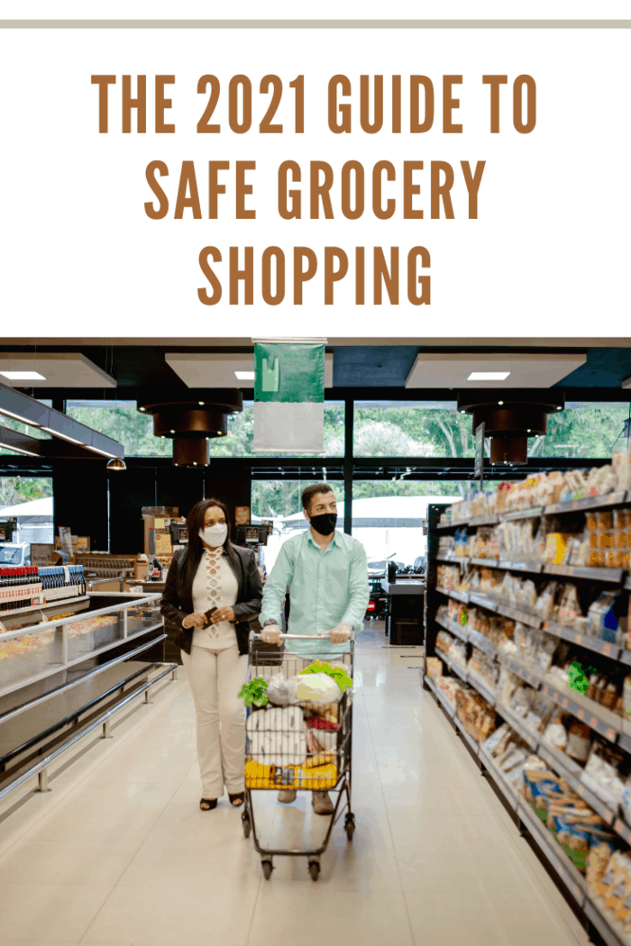 Couple shopping at grocery store, using face mask