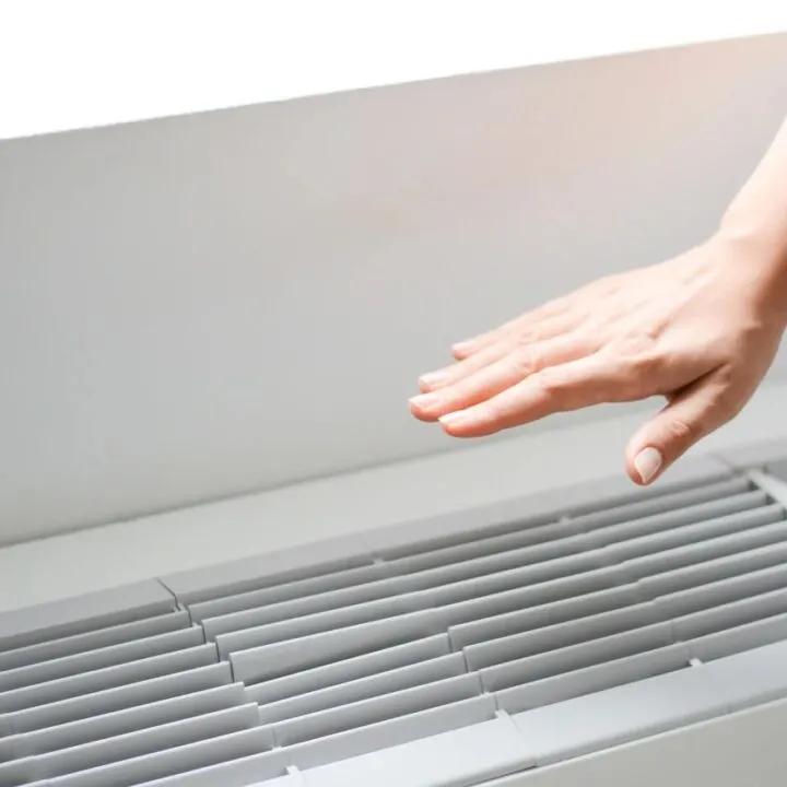 hand over air conditioner vent