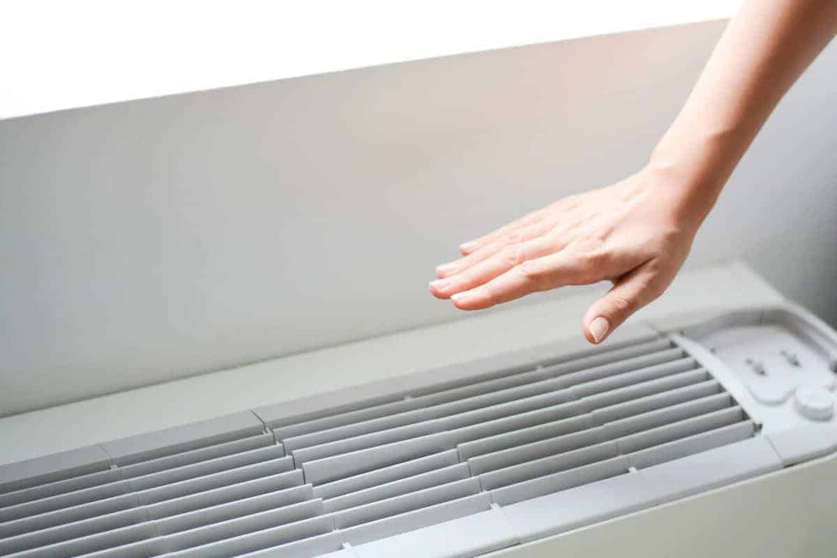 hand over air conditioner vent
