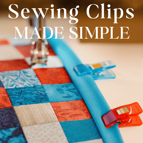 Close-up of sewing clips securing blue binding to a colorful patchwork quilt under a sewing machine presser foot, with warm lighting and elegant text overlay “Binding Love: Clip It Good!”