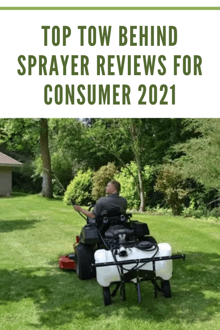 man spraying lawn with tow behind sprayer