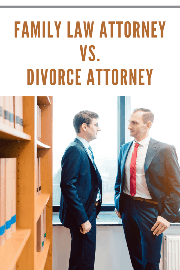 Two attorneys discussing very interesting topics in law firm standing in front of book shelf