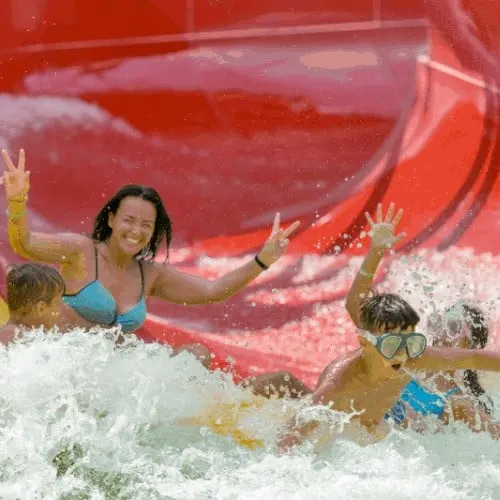 Friends on a water slide in the water park
