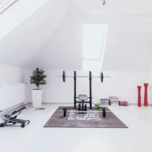 Small gym arranged in white room at home
