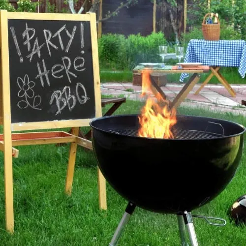 Backyard BBQ Grill Party Scene.Chalkboard With Sign Party Here BBQ, Flaming Grill, Wood Outdoor Furniture, Garden Decoration, Wine, Picnic Basket