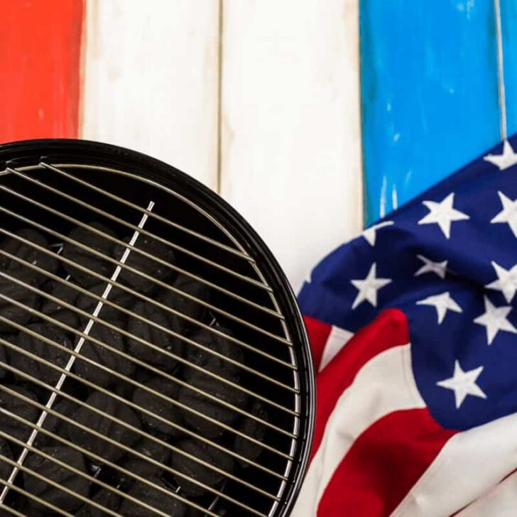 Table set with white, blue and red decorations for July 4th barbecue.