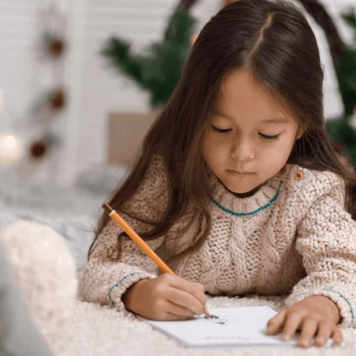 young brunette girl practicing to write faster.