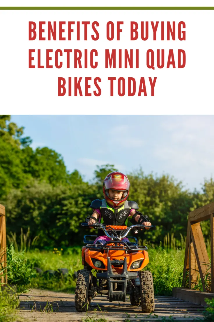 The little girl rides a quad bike. A mini quad bike is a cool girl in a helmet and protective clothing. Electric quad bike electric car for children popularizes green technology