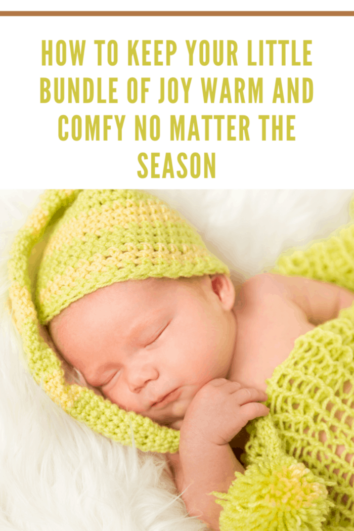 High Angle View Of A Baby In Green Warm Clothing Sleeping