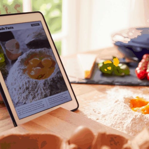 Person Following Pasta Recipe Using recipe App for Android On Digital Tablet