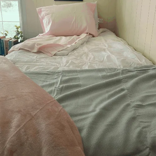 cooling blanket on bottom of bed