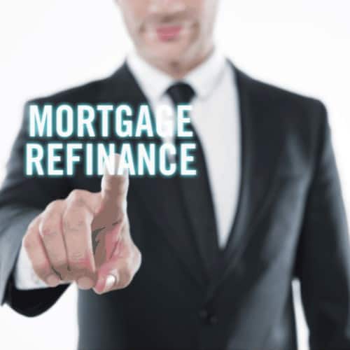 businessman touching a virtual screen quoting”Mortgage refinance”