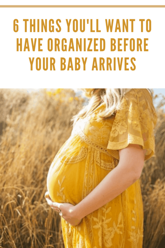 pregnant woman in yellow dress in wheat field