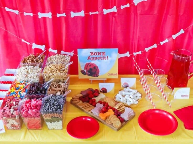 This kid-friendly charcuterie board is full of kid-favorite meats, cheeses, fruits, and vegetables. Bone-shaped cookie cutters add to the fun. This snack will be a BIG hit for a Clifford The Big Red Dog movie watch party!