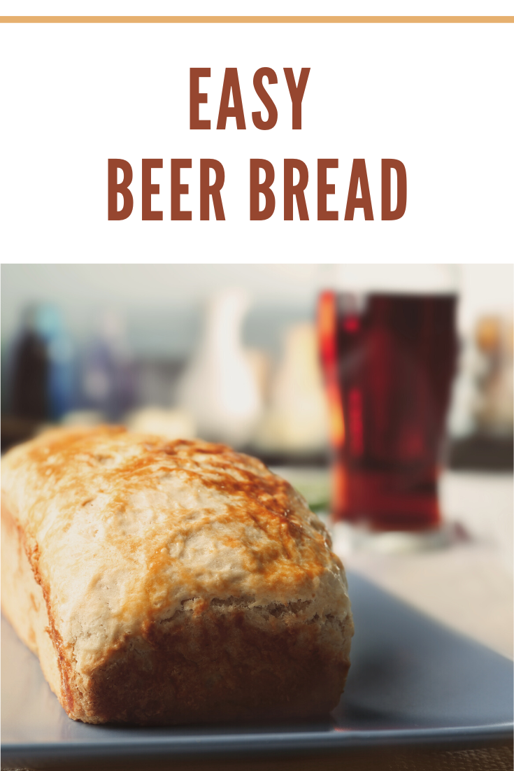 tasty loaf of cheesy beer bread on table