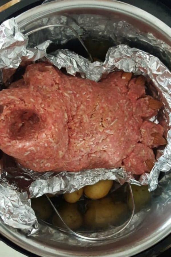 Footloaf being placed into an Instant Pot, showcasing a simple and delicious recipe.