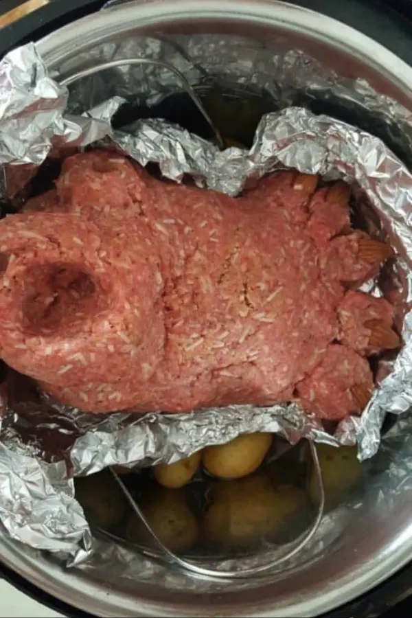 Footloaf being placed into an Instant Pot, showcasing a simple and delicious recipe.