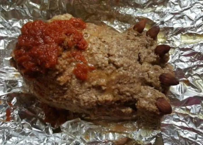 Overhead view of a cooked footloaf in the Instant Pot, showing a golden, flavorful meal.