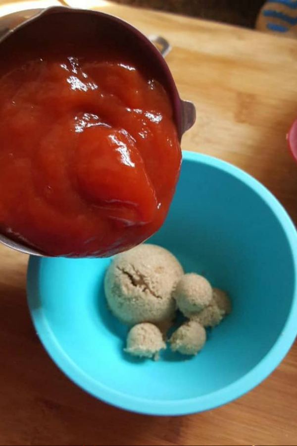 Preparing ooey-gooey sauce for Instant Pot Footloaf, adding a spooky and tasty touch.