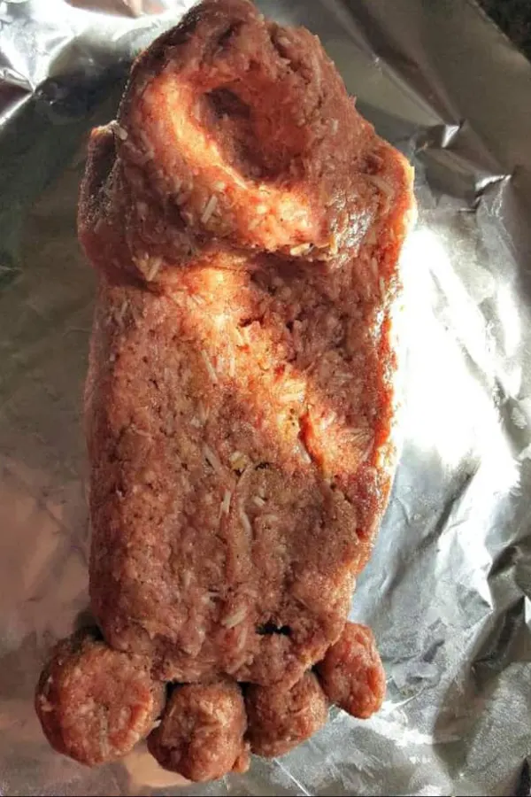 Adding meatball toes to foot-shaped Instant Pot Footloaf for a spooky Halloween meal.