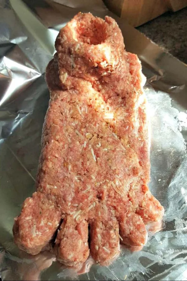 Shaping meatloaf toes on a foot-shaped Instant Pot Footloaf for a Halloween party