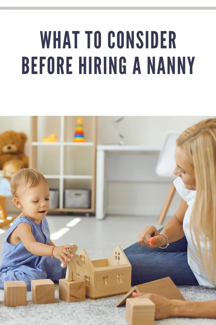 cheerful nanny playing with blocks to entertain toddler