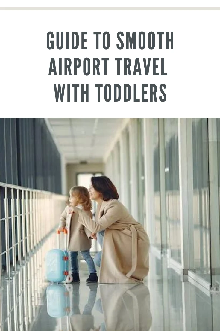 mom kneeling next to toddler at airport