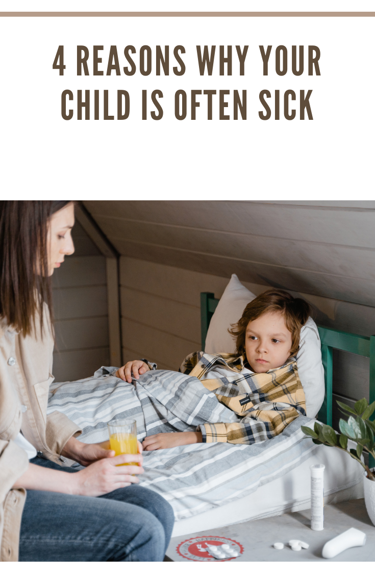 mother sitting next to sick child