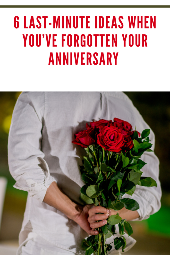 roses behind back of man celebrating anniversary