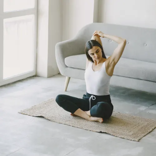 woman exercising in living room