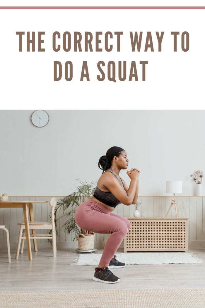 woman doing squats at home