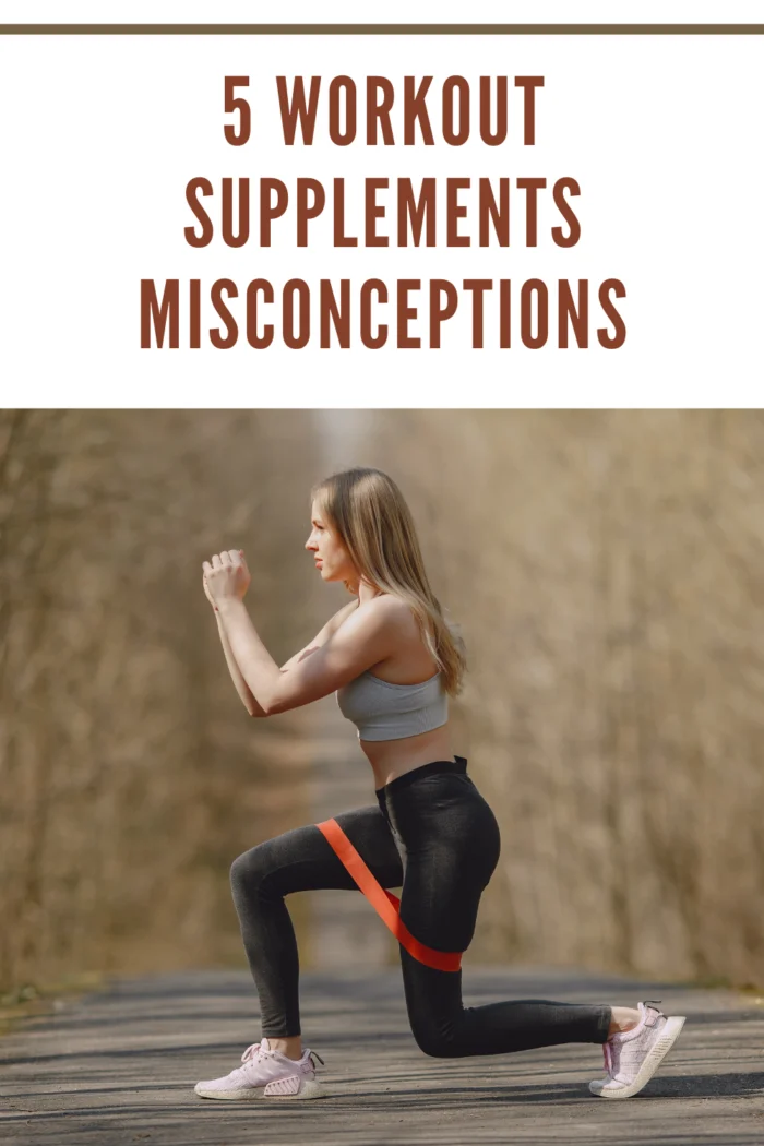 young woman doing fitness workout with bands in park