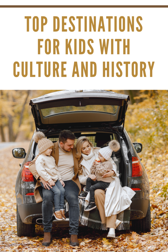 family on fall adventure resting in back of suv